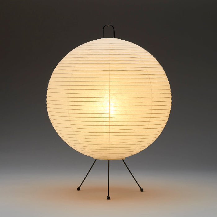 Spherical lamp with a paper shade on a dark background