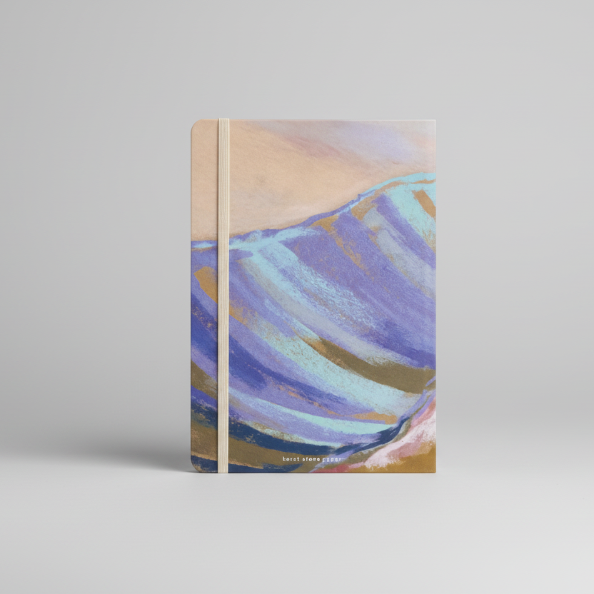Notebook with abstract mountain design on a white background