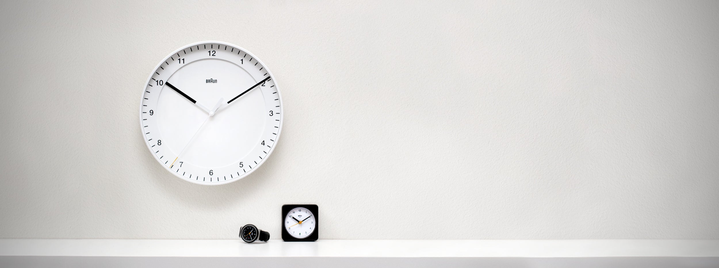 Braun, a German brand known for its iconic, minimalist design in electronic products, including clocks, shavers, and kitchen appliances, emphasizing simplicity and functionality.