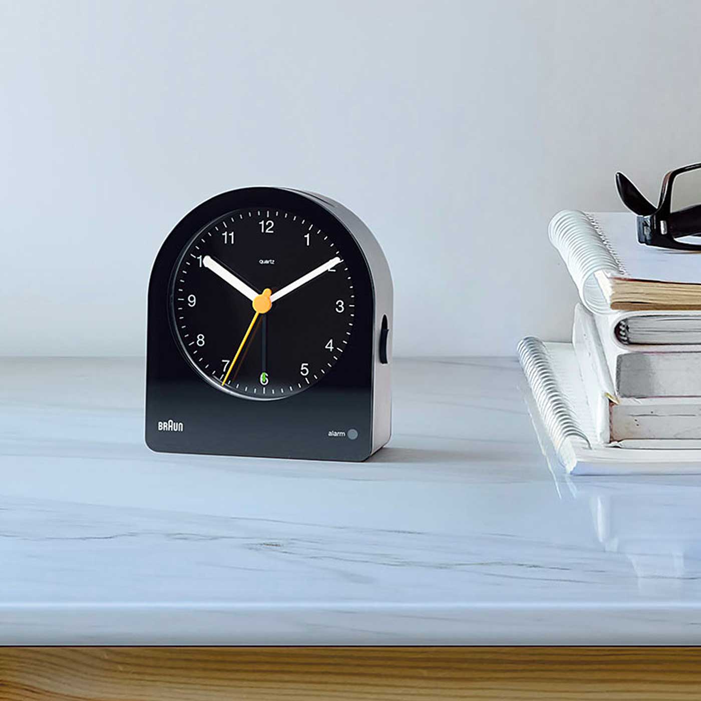 Braun, a German brand known for its iconic, minimalist design in electronic products, including clocks, shavers, and kitchen appliances, emphasizing simplicity and functionality.