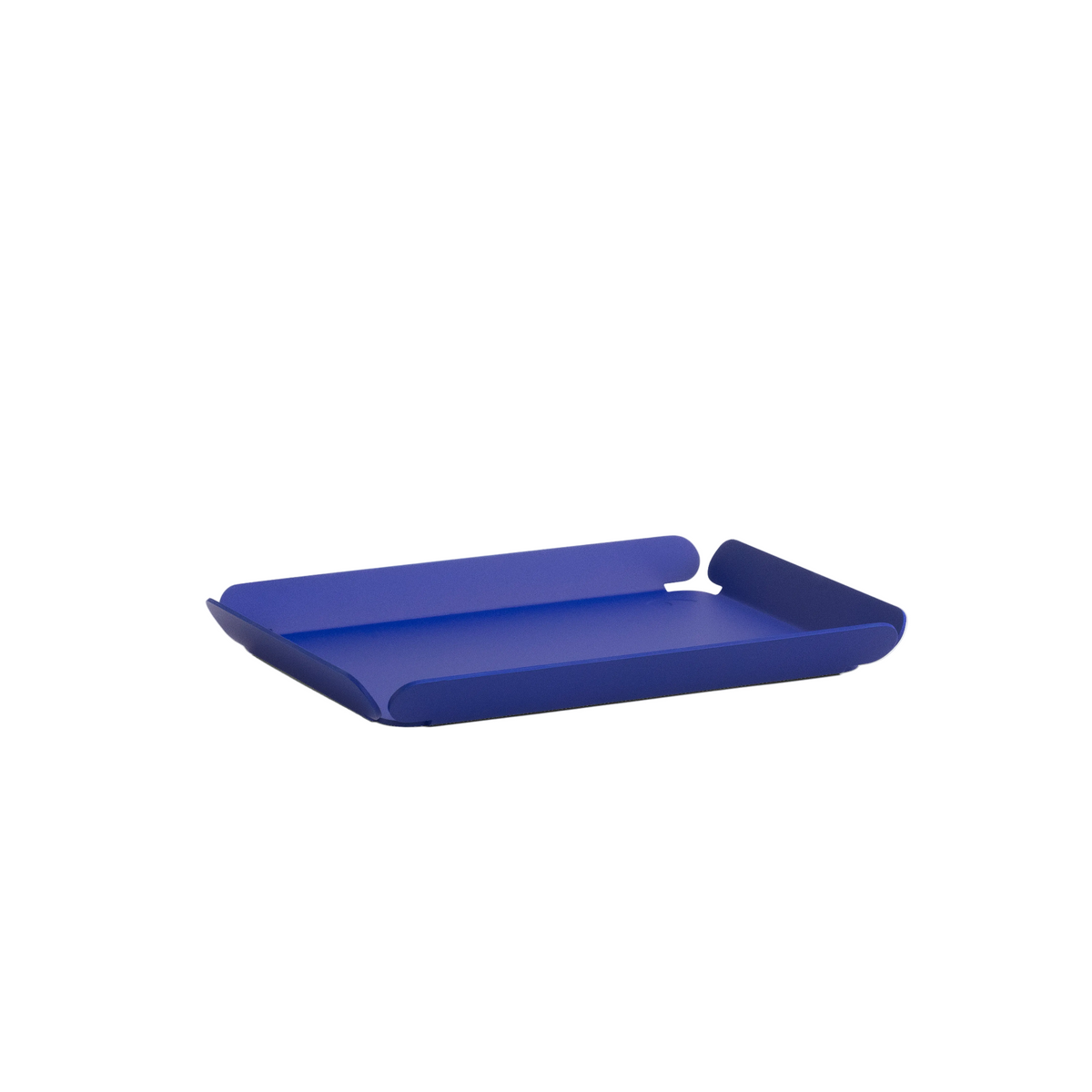 Minimalist cobalt blue desk tray with a slim rectangular form and softly curved raised edges, designed for organizing small items, shown on a white background.