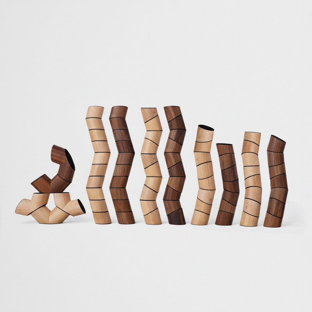 Set of wooden sculptures with wavy, organic shapes on a white background