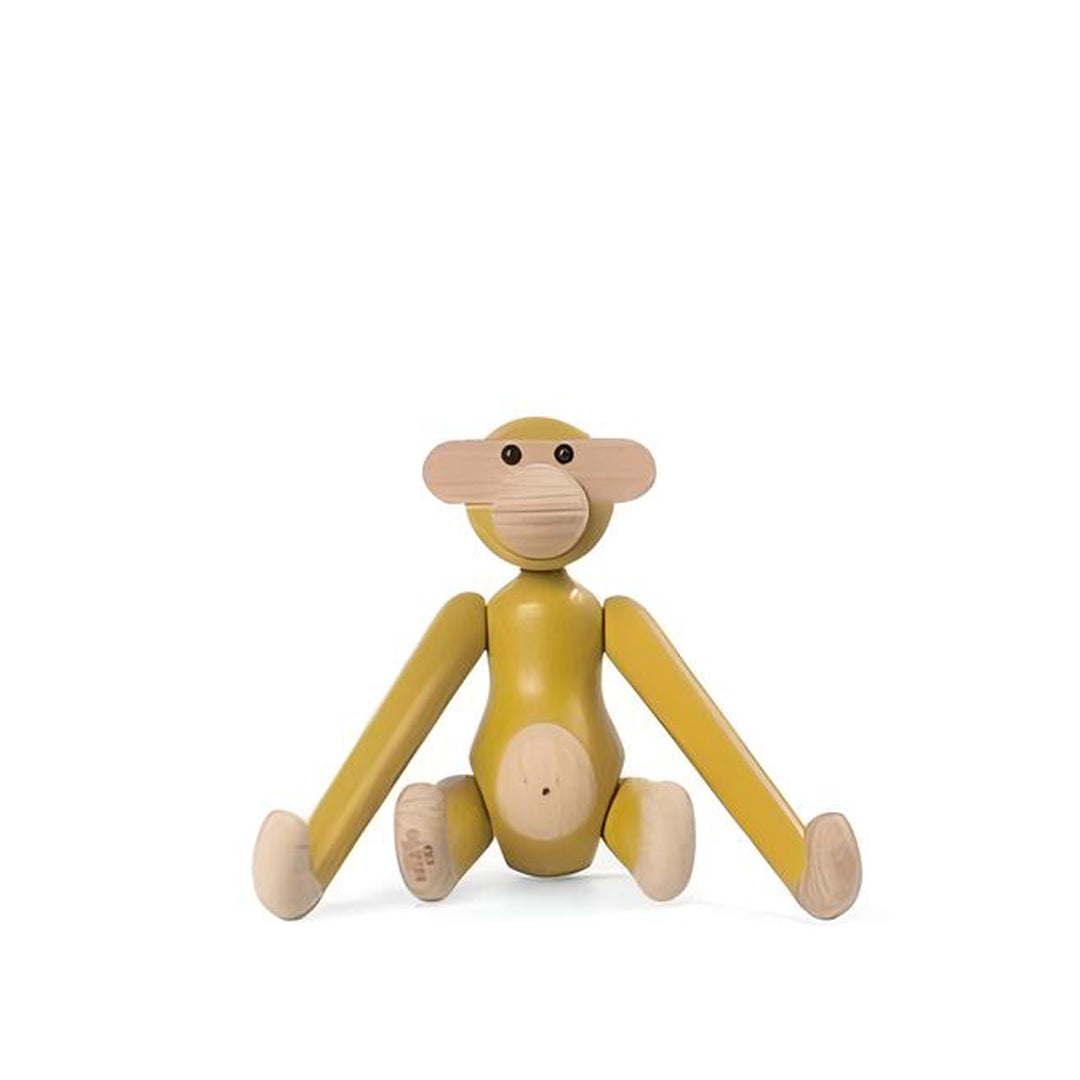 Kay Bojesen, a Danish designer renowned for his playful and iconic wooden figurines, including the beloved wooden animals and figurines that blend craftsmanship with a joyful aesthetic.