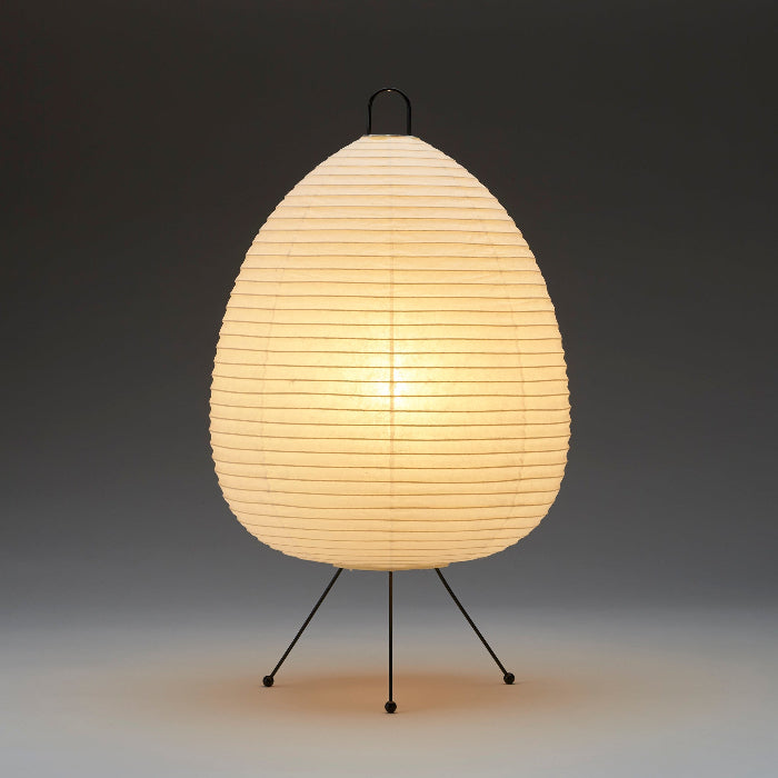 Egg-shaped lamp with a soft glow on a dark background