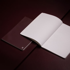 Open notebook on a dark surface