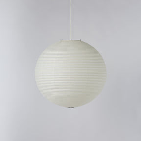 A spherical pendant light with a ribbed, paper lantern-like texture in an off-white color, suspended by a thin white cord against a neutral light gray background.