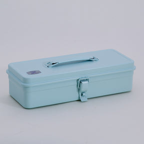 glacier Toyo Steel metal toolbox with a smooth enamel finish, long rectangular shape, top carry handle, and single front latch, shown closed on a neutral studio background.