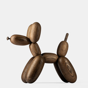 Wooden sculpture of a dog in balloon shape on a white background