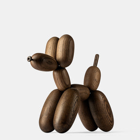 Wooden dog sculpture on a white background