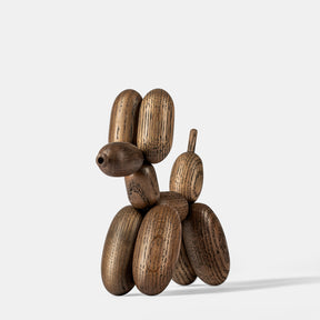 Wooden dog sculpture on a white background