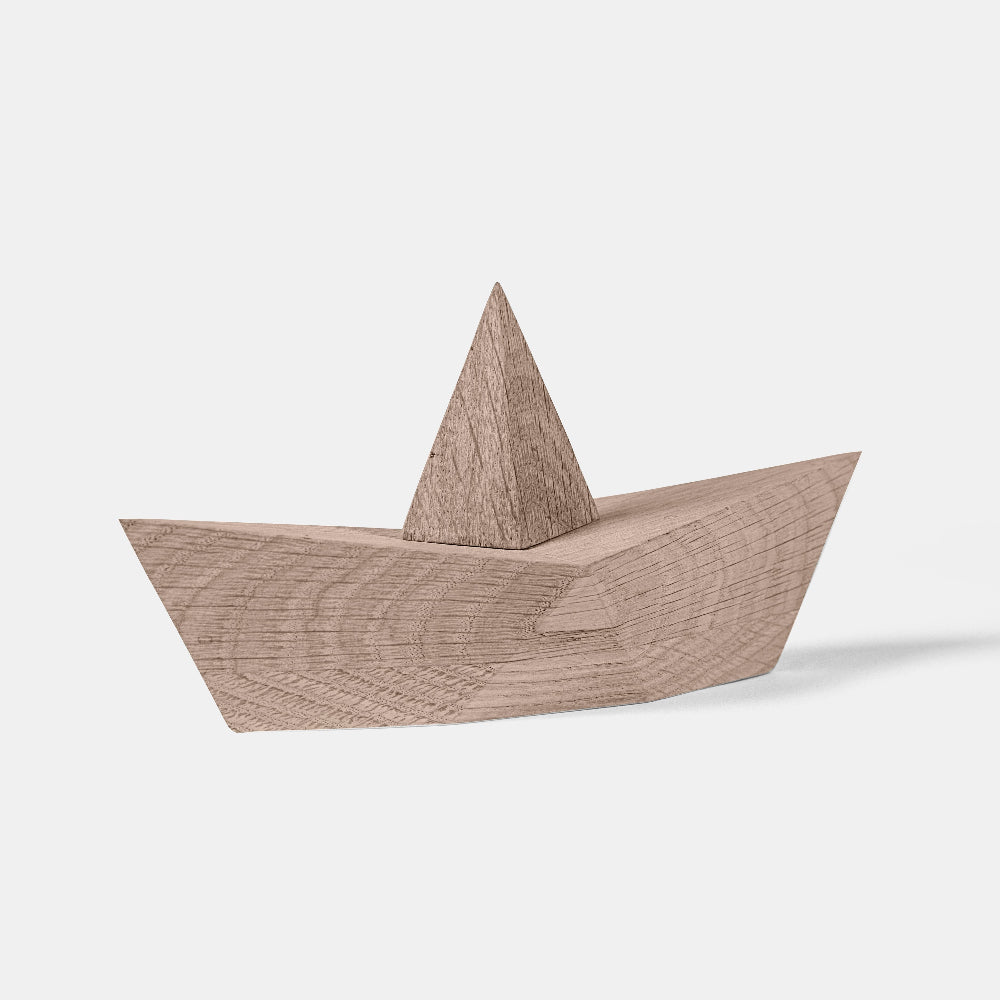 Wooden boat toy on a white background