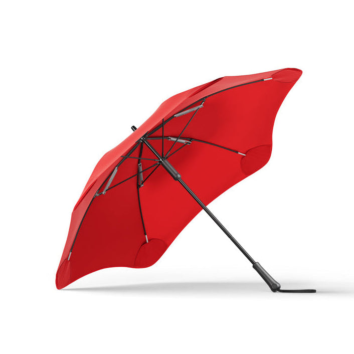 Red umbrella with black frame on a white background