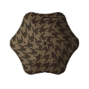 Hexagonal cushion with brown houndstooth pattern on a white background