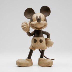 Wooden Mickey Mouse figurine on a white background