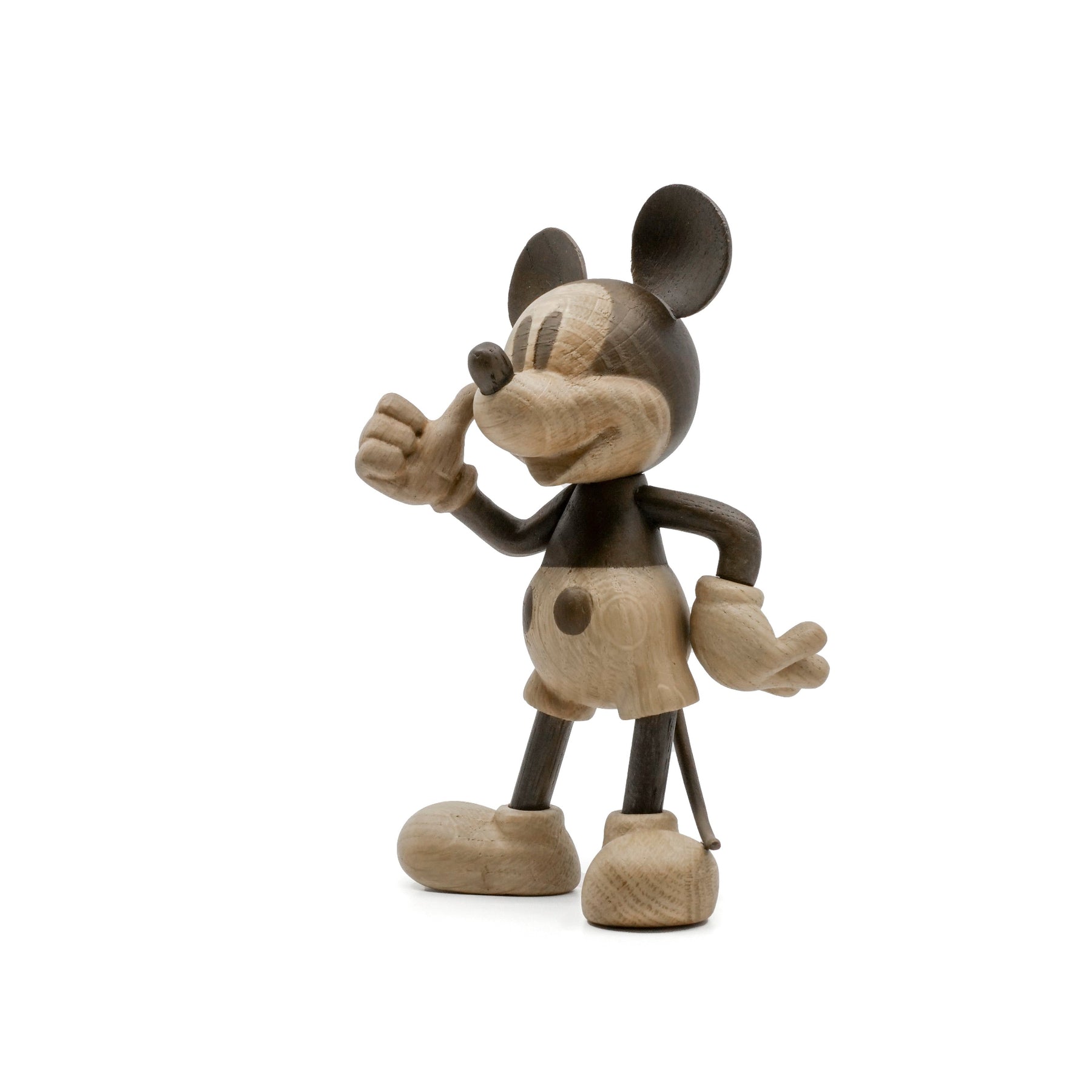 Wooden Mickey Mouse figurine on a white background