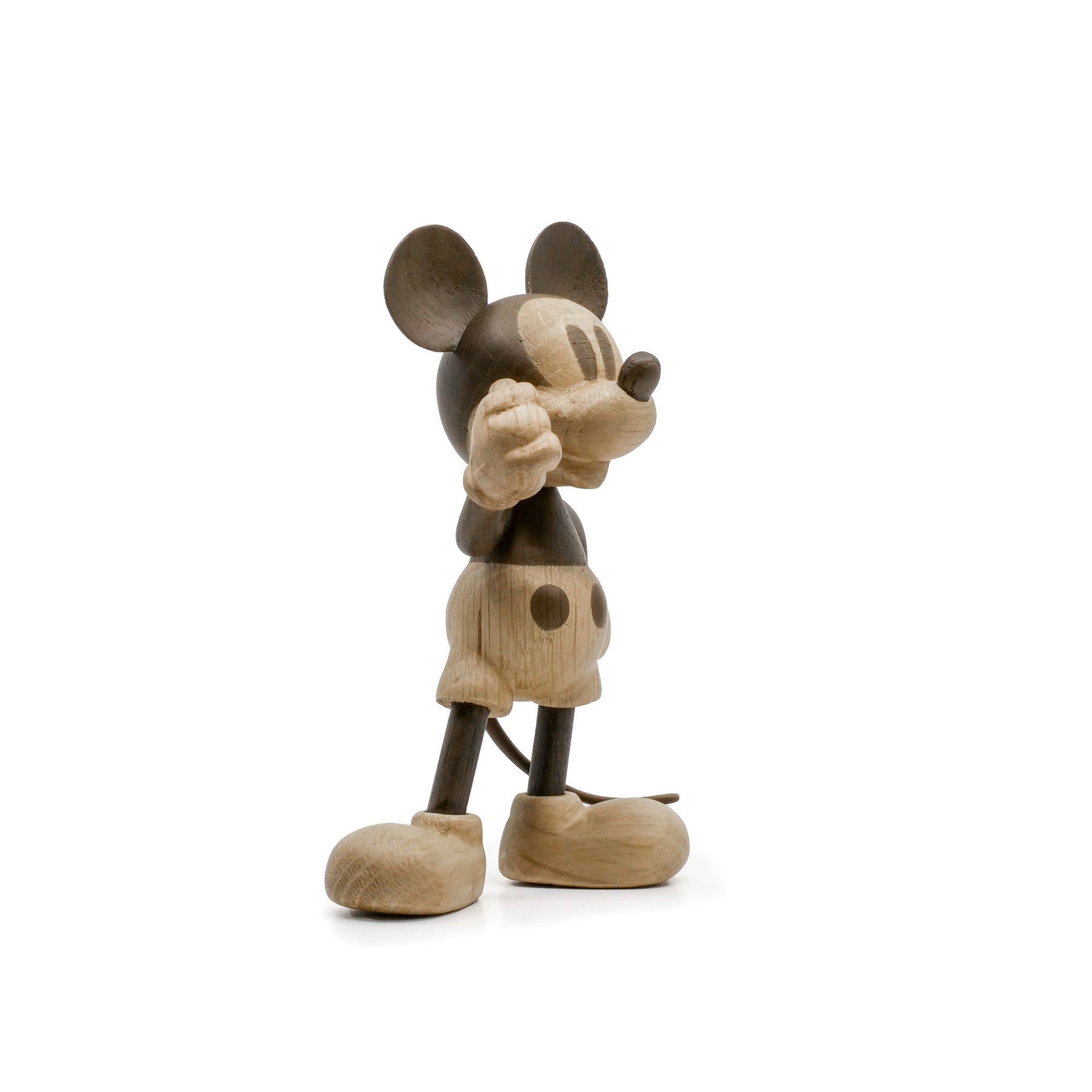 Wooden Mickey Mouse figurine on a white background