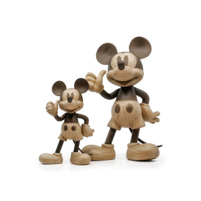 Wooden Mickey and Minnie Mouse figures on a white background