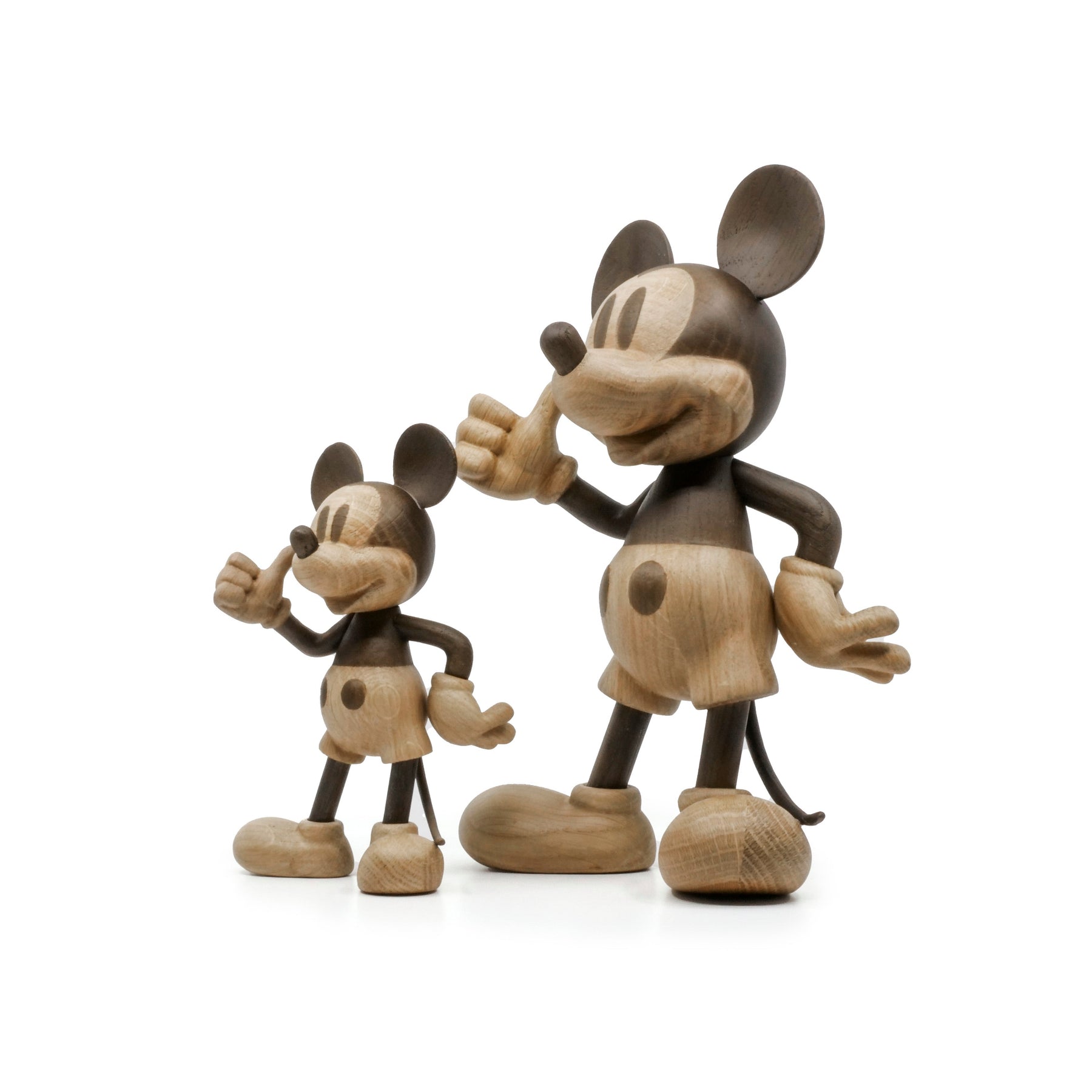 Wooden Mickey Mouse figurines on a white background