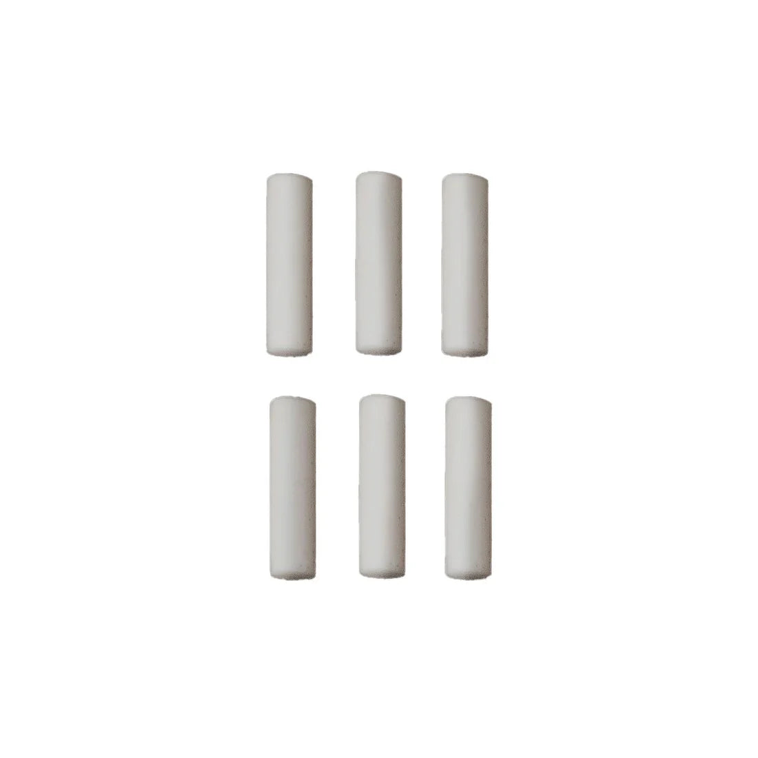 Set of six cylindrical white objects on a white background