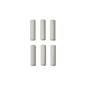Set of six cylindrical white objects on a white background