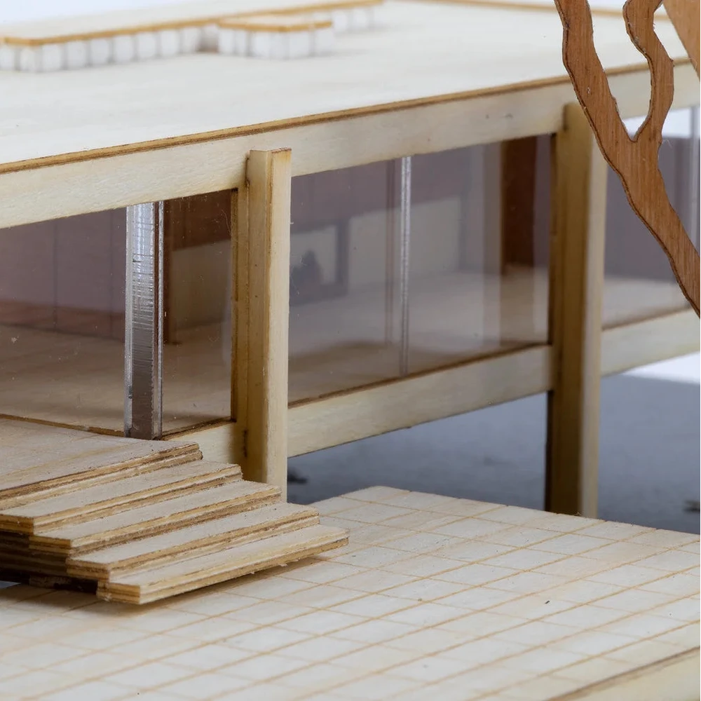 Wooden model of a building with transparent panels