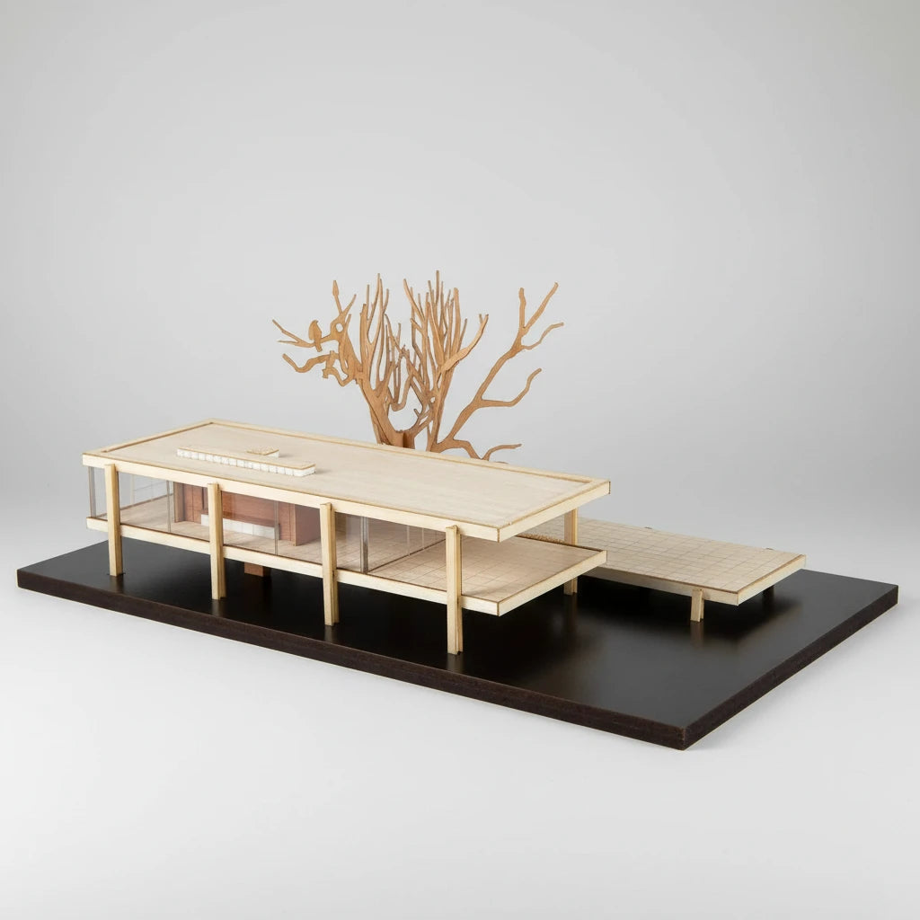 Model of a modern outdoor furniture set with a tree sculpture on a black platform
