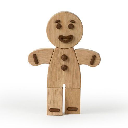 Wooden gingerbread man toy on a white background