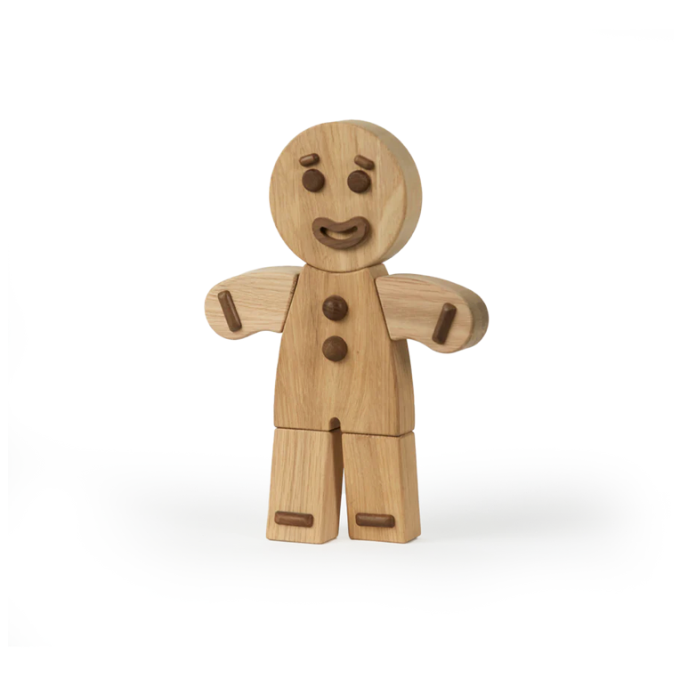 Wooden gingerbread man figure on a white background