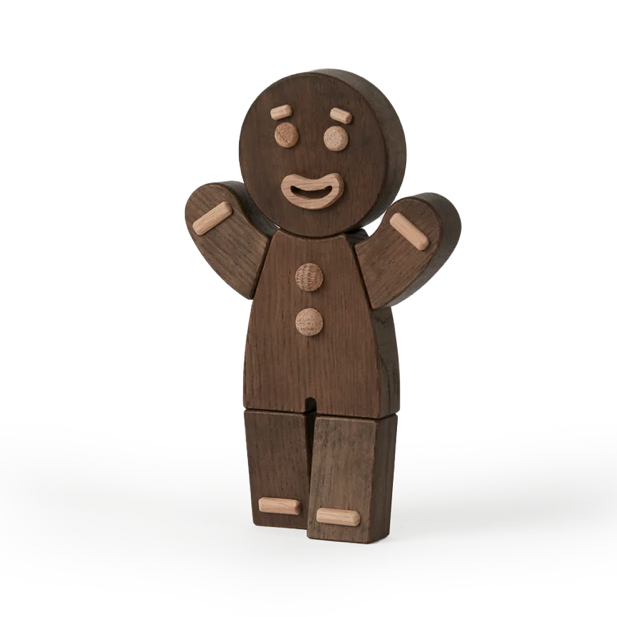 Wooden gingerbread man toy on a white background