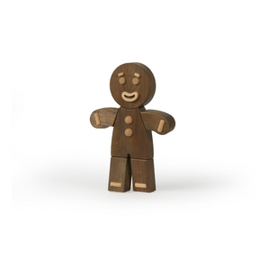 Wooden gingerbread man figure on a white background
