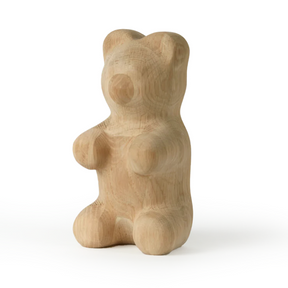 Wooden bear figurine on a white background