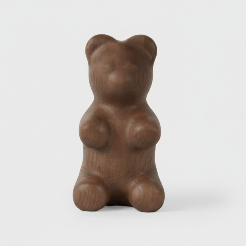 Wooden bear figurine on a white background
