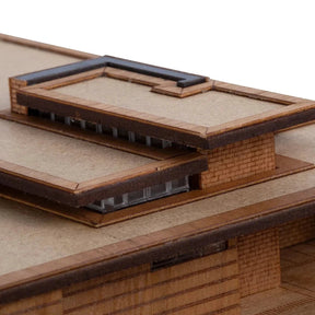 Close-up of a model architectural structure with detailed facades.