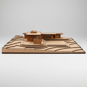 Wooden model of a modern house on a white background