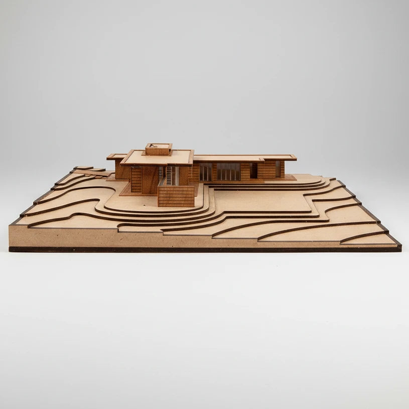 Wooden model of a modern house on a white background