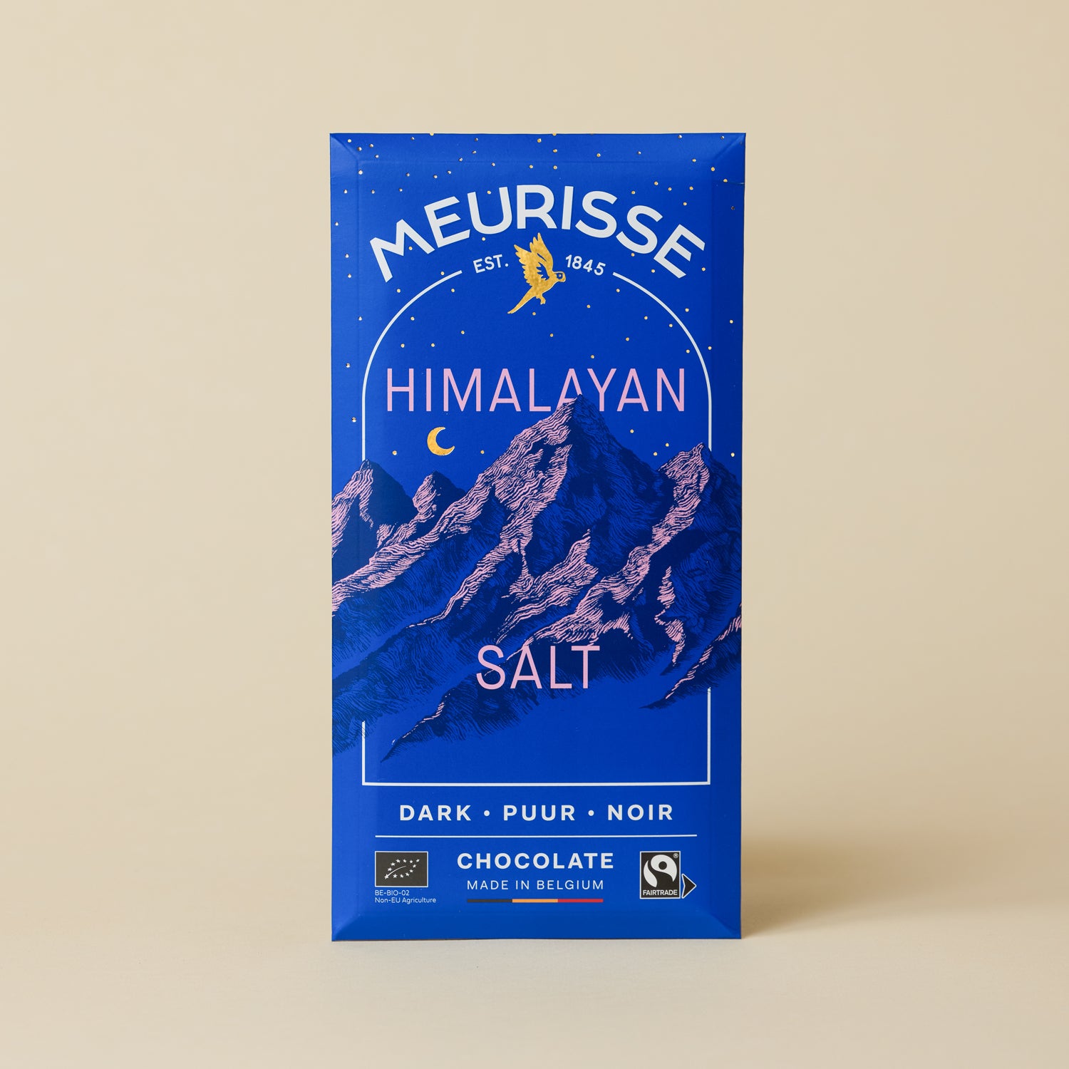 Meurisse Himalayan Salt dark chocolate bar in deep blue packaging with illustrated mountain landscape and night sky, labeled ‘Himalayan Salt,’ standing upright against a neutral beige background.