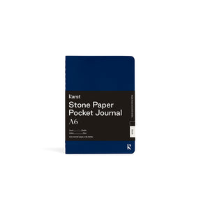 Blue pocket journal with text on a white background