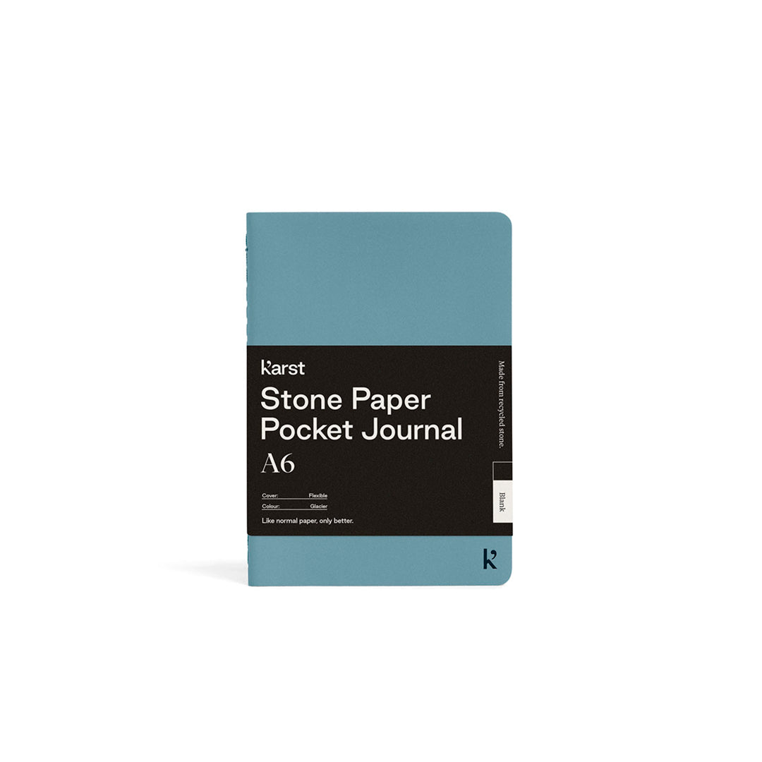 Blue pocket journal with 'Karst Stone Paper' branding on a white background