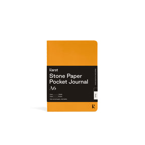Yellow pocket journal with black label on a white background