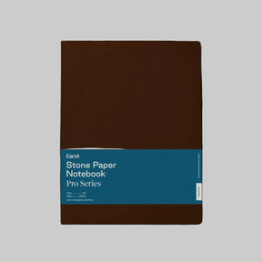 Karst Stone Paper Notebook Pro Series with an espresso brown cover and blue belly band, shown front-facing on a light gray background.