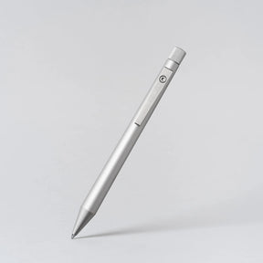 Silver pen on a light gray background