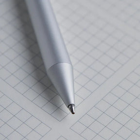 White pen on a grid background