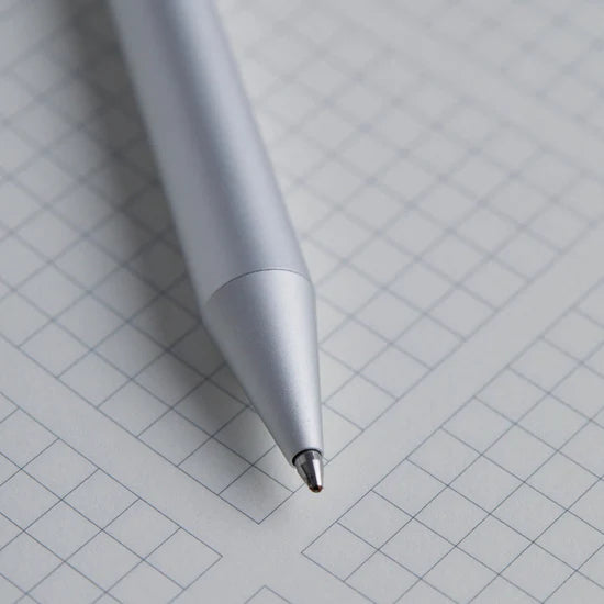 White pen on a grid background