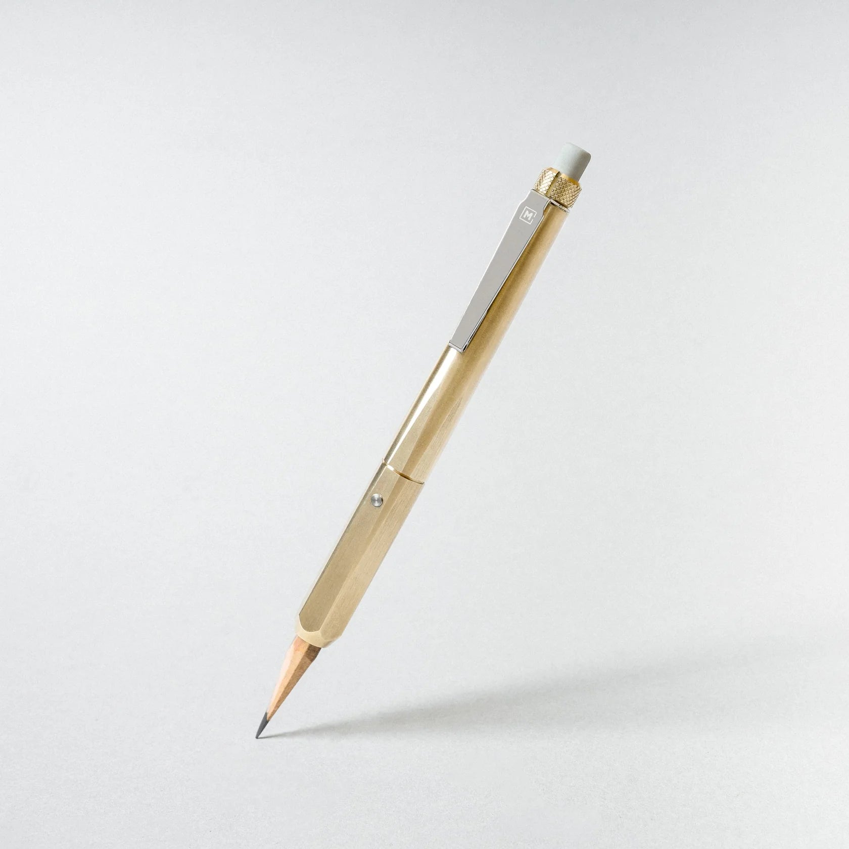 Gold and silver pen on a white background