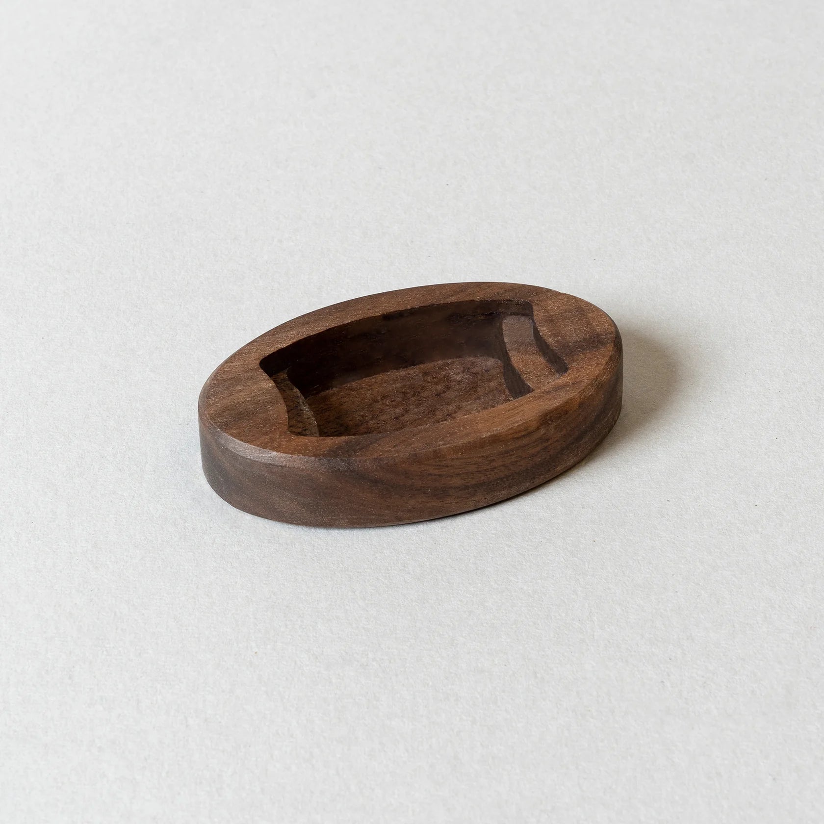 Wooden bowl on a light gray background