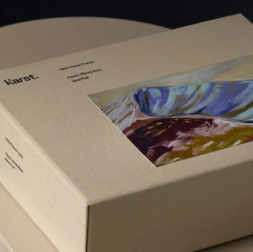 Karet art packaging with a colorful abstract painting on a dark background