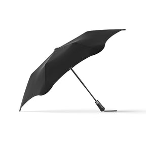 Black umbrella on a white background