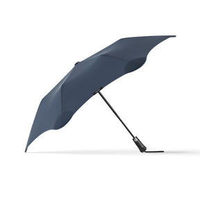 Dark blue umbrella on a white background