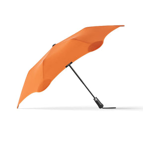 Orange umbrella on a white background