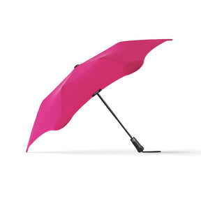 Pink umbrella on a white background